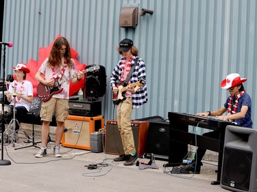Westward Oddities, drummer Andrew Crozier, guitarists Cailan Davis and Nathan Burrill, and Andrew Hudson on keyboard, perform at Prescott's Canada Day celebration. (RONALD ZAJAC/The Recorder and Times)