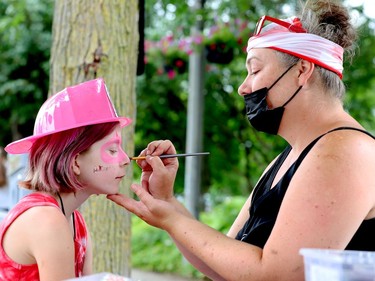Claire Fowler, 10, gets her face painted by Jenny Holdsworth during Prescott's Canada Day celebration. (RONALD ZAJAC/The Recorder and Times)