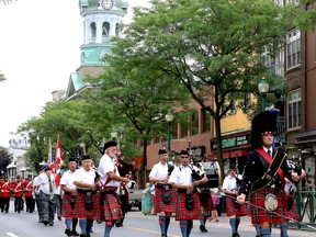 The Brockville Pipes and Drums march on King Street to lead the city's Canada Day parade on Friday. (RONALD ZAJAC/The Recorder and Times)