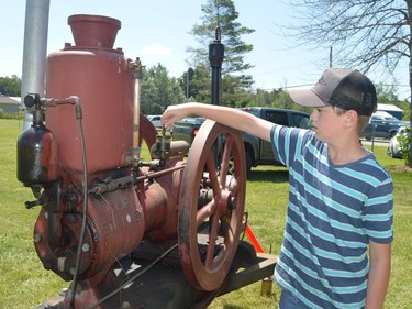 Kyle Miller operates his grandfather's 1913 Stickney at the 41st Farmersville Exhibition in Athens on Saturday.
Tim Ruhnke/The Recorder and Times