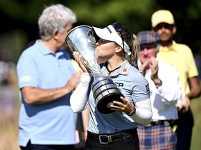 Brooke Henderson of Smiths Falls lifts the trophy after winning the The Amundi Evian Championship in Evian-les-Bains, France on Sunday. It's the second major win of her pro golf career.
Stuart Franklin/Getty Images