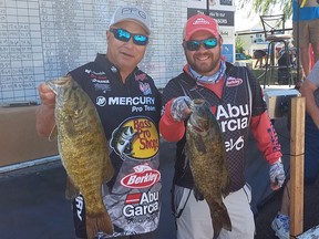 Canadian fishing legend Bob Izumi, left, and his son Darren Izumi, display some of their catch after participating in the Canadian Tire Mitchell's Bay Open for the first time on the weekend.  PHOTO Ellwood Shreve/Chatham Daily News