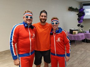 Chatham-Kent firefighters Jason King, left, and Eric Smith, right, may have finished second in their division at the 'Rally at the Barn' pickleball fundraiser for the Lighthouse Foundation on Saturday in Dresden, but they were tops when it came to style. They are seen here with NHL'er T.J. Brodie, who hosted the pickleball weekend event with his wife Amber, both Dresden natives. PHOTO Ellwood Shreve/Chatham Daily News