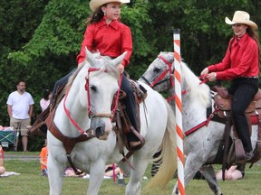 Pippa James, age 10, is seen here on horse Zephyr, 15 hands-high Greg registered Paint gelding, as she plays musical poles with Off Kilter teammate Mackenzie Vollans during the Woodslee 2022 Canada Day festival. (Contributed photo Emily James)