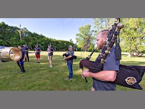 Quinn Findlay, pipe major for the Paris Port Dover Pipe Band leads a rehearsal on Wednesday June 22, 2022 in St. George, Ontario. Twenty-five members of the band are heading to Scotland July 28 to perform in the Royal Edinburgh Military Tattoo.