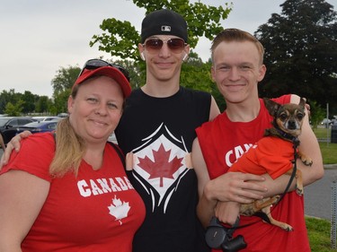 From left, Kimberly, Jordan, and Jacob Bowman, holding pup Precious, who was wearing her Canada Day shirt on Friday July 1, 2022 in Cornwall, Ont. Shawna O'Neill/Cornwall Standard-Freeholder/Postmedia Network