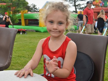 Tahlia Thompson-Hollister learning how to play drums at Lamoureux Park on Friday July 1, 2022 in Cornwall, Ont. Shawna O'Neill/Cornwall Standard-Freeholder/Postmedia Network