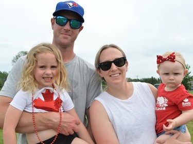 From left, dad Andrew Downing holding Carman, with mom Alyssa holding Lennon during Canada Day fun on Friday July 1, 2022 in Long Sault, Ont. Shawna O'Neill/Cornwall Standard-Freeholder/Postmedia Network