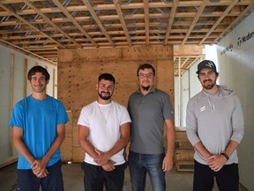 From left, Platon Liolios, Alex Liolios, Jeremiah Point, and Brock Wilson inside the classic passive house on Wednesday June 29, 2022 in South Glengarry, Ont. Shawna O'Neill/Cornwall Standard-Freeholder/Postmedia Network