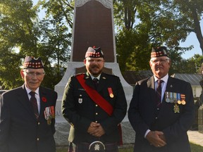 From left, Lt.-Col. Bill Shearing (retired), warrant officer Justin Delorme, Lt.-Col. Roy Clarke (retired), pictured at the rededication of the Morewood Cenotaph on Wednesday July 6, 2022 in Morewood, Ont. Shawna O'Neill/Cornwall Standard-Freeholder/Postmedia Network