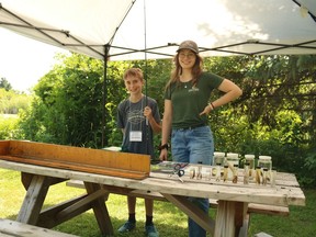 A volunteer and staff member at the measuring station for the fish caught at this year's Family Fishing Day. From left: Jeff Murphy and Jamie Would on Friday July 8, 2022 in Cornwall, Ont. Laura Dalton/Cornwall Standard-Freeholder/Postmedia Network