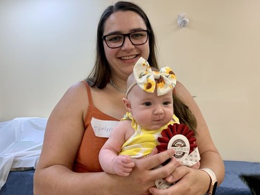 Mom Josee Turcotte was happy to see baby Evelyn win some awards at the baby show in the under six months category at the 2022 Avonmore Fair on Saturday July 16, 2022 in Avonmore, Ont. Shawna O'Neill/Cornwall Standard-Freeholder/Postmedia Network