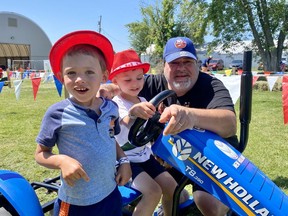 From left to right, Liam and Benjamin Derouchie enjoying some time with grandpa Garnet Bellmore at the 2022 Avonmore Fair on Saturday July 16, 2022 in Avonmore, Ont. Shawna O'Neill/Cornwall Standard-Freeholder/Postmedia Network