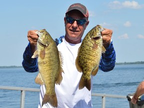 Renegade Bass Tournament participant John Traakas showing off some of his catches before weighing in on Sunday July 17, 2022 in Morrisburg, Ont. Shawna O'Neill/Cornwall Standard-Freeholder/Postmedia Network