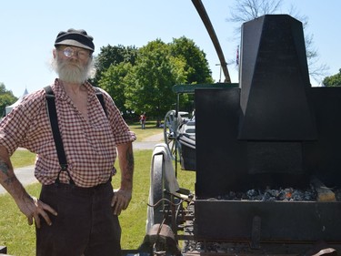 Pat Taylor manning a mobile blacksmithing display, from the Glengarry Pioneer Museum, at Upper Canada Village on Sunday July 17, 2022 in South Dundas, Ont. Shawna O'Neill/Cornwall Standard-Freeholder/Postmedia Network