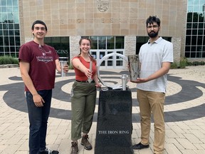 From left to right: Sebastian Tattersall, Anna Esposito, and Yuvraj Sandhu, all McMaster University students involved in designing and creating the Canadian Remembrance Torch. Handout/Cornwall Standard-Freeholder/Postmedia Network