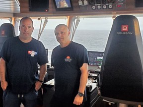 Mark MacLennan (left) on board the OceanGate Titanic Expedition in July 2022, pictured with Captain Gilles Poirier. Handout/Cornwall Standard-Freeholder/Postmedia Network