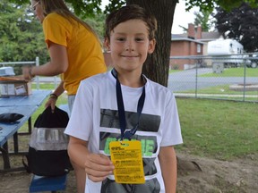 Jaxson Pidgeon with his medal for participating in the City's Biodiversity Workshop on Thursday July 28, 2022 in Cornwall, Ont. Shawna O'Neill/Cornwall Standard-Freeholder/Postmedia Network