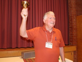 Ian MacLean, co-organizer of the North Valley Public School Reunion, rings the bell to start the festivities. Photo on Thursday, July 28, 2022, in Ingleside, Ont. Todd Hambleton/Cornwall Standard-Freeholder/Postmedia Network