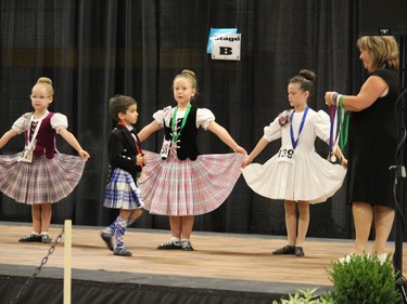 Medal presentation time, for some of the Highland Dancing competitors on the stage in the arena. Photo on Friday, July 29, 2022, in Maxville, Ont. Todd Hambleton/Cornwall Standard-Freeholder/Postmedia Network