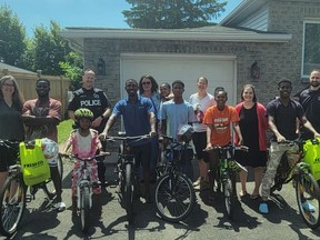 Handout/Cornwall Standard-Freeholder/Postmedia Network
Some of the Cornwall bike project recipients, with organizers and community partners involved in the effort on June 24, 2022.