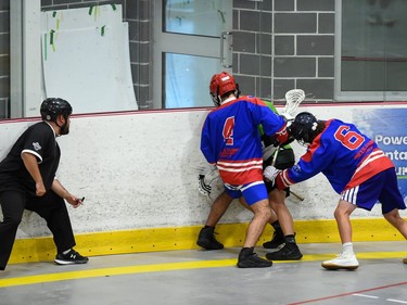 Whitby Warriors players Matteo Siciliano (No. 4) and Adam Smellie box in a Cornwall Celtics player during Game 4 first-round playoff play on Sunday July 3, 2022 in Cornwall, Ont. Cornwall lost this game 7-6, and the best-of-five series is tied 2-2. Robert Lefebvre/Special to the Cornwall Standard-Freeholder/Postmedia Network
