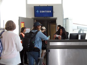 Handout/Cornwall Standard-Freeholder/Postmedia Network
Passengers board the inaugural Contour Airlines flight between Plattsburgh, N.Y., and Philadelphia, Pa., on Friday, July 1, 2022, at the Plattsburgh International Airport.