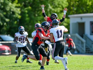 Cornwall Wildcats Aidan Wilson (No. 52) reaches for the ball during the team's game against the Myers Riders on Saturday July 9, 2022 in Cornwall, Ont. The Wildcats lost 42-36. Robert Lefebvre/Special to the Cornwall Standard-Freeholder/Postmedia Network
