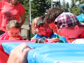 Dante Fasan eyes up the competition during the pie eating contest on Saturday, July 22, 2017 at Bragg Creek Days in Bragg Creek, Alta. (Patrick Gibson/Cochrane Times/Postmedia Network)