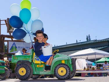 Two boys enjoy the Bragg Creek Days parade in Bragg Creek on Saturday, July 16, 2022.