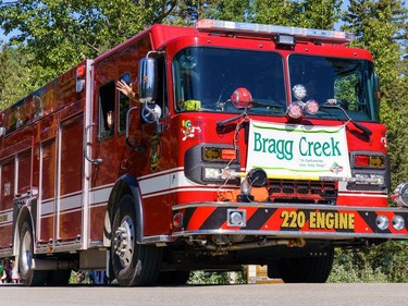 Redwood meadows emergency services engine 220 leads the parade in Bragg Creek on Saturday, July 16, 2022.