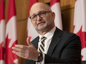 Minister of Justice and Attorney General of Canada David Lametti speaks about repealing mandatory minimum sentences during a news conference, Tuesday, December 7, 2021 in Ottawa.