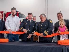 West Perth Mayor Walter McKenzie (left), MPP Matthew Rae, Deputy Station Chief Ken Monden (with Perth East/West Perth Chief Bill Hunter lurking in background), Station Chief Jim Tubb, MP John Nater with daughter Caroline and Deputy Fire Marshal Tim Beckett celebrated the grand opening of West Perth’s new fire hall in Mitchell on July 9. CHRIS MONTANINI