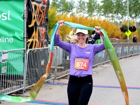 Alanna McMaster crosses the finish line as the first woman to complete the 2021 Fort McMurray Marathon on Sunday, September 26, 2021. Laura Beamish/Fort McMurray Today/Postmedia Network