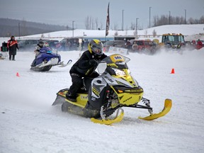 A racer pulls ahead from his competitors at the King of the River snowmobile race on the Snye in Fort McMurray, Alta. Saturday, Jan. 6, 2018. Olivia Condon/ Fort McMurray Today/ Postmedia Network
