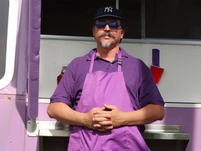 Jeremy Cavenagh stands in front of the serving window of the Burrito Bus, a new food truck business in Hanna that Cavenaugh runs with his wife Aude and partner John Finley. Jackie Irwin/Postmedia