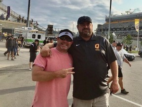 Jeff Hoover, left, has launched a GoFundMe campaign to support Queen's University football coach Dale Sands, right, as he recovers from spinal surgery.