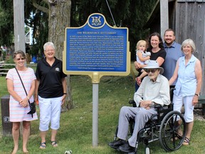 An updated Ontario Heritage Trust plaque was installed in Lucan July 14, commemorating the historic Wilberforce settlement. Members of the Butler family, above, whose local roots date back to Wilberforce, attended. Front from left are Wendy Hiscox, Marlene Thornton, Ed and Annelies Butler and in back, Brynn, Rachel and Allan Baxter. Jackie Martens