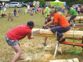 File photo
The two-person crosscut saw contest draws a fair number of competitors as well as spectators.