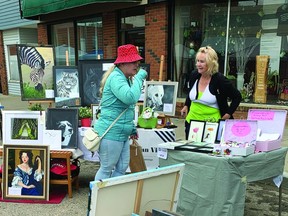 Lethbridge's Debby Hawkin, right, was among the artists selling their work at the Nanton Art Festival July 2 along Main Street. STEPHEN TIPPER