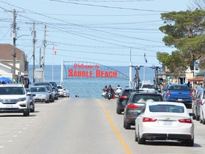 Cars drive along Main Street in Sauble Beach in this file photo