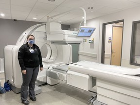 Katie Fadock, nuclear medicine technologist and radiation safety officer at the Pembroke Regional Hospital, stands with the facility's new $1 million state-of-the-art nuclear medicine machine.