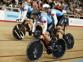 Nick Wammes, right, of Bothwell, Ont., is on the track with Canadian teammates Tyler Rorke and Ryan Dodyk for the men's team sprint bronze-medal race at the Commonwealth Games in London, England., on Friday, July 29, 2022. (John Sibley/Reuters)