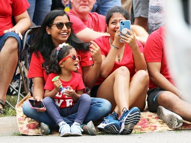 Anipa Tripathi and daughter Lekha, 3, from Sarnia smile as they watch the city's Canada Day parade on Friday. Terry Bridge/Sarnia Observer/Postmedia Network
