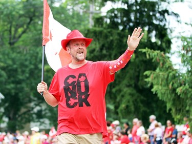 A man waves at the crowd during Sarnia's Canada Day parade on Friday. Terry Bridge/Sarnia Observer/Postmedia Network