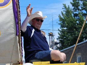 Jack Stirling, recently named Plympton-Wyoming's senior of the year, waves to the crowd during the town's Canada Day parade on Saturday.  Terry Bridge/Sarnia Observer/Postmedia Network