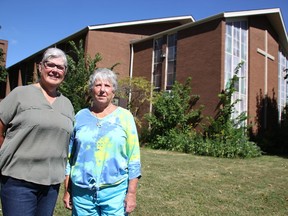 Diane Slack and Shirley Martin stand outside St. Paul's United Church in Sarnia. The church is closing and affordable housing is proposed for the site, the church officials said. (Tyler Kula/ The Observer)