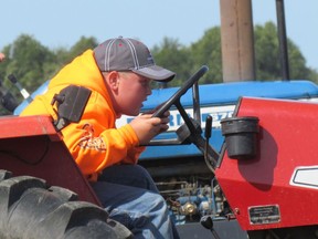 Kyle Ross from Wabash, Ont., leans into the competition at the 2017 Lambton County Plowing Match held in Dawn-Euphemia Township.