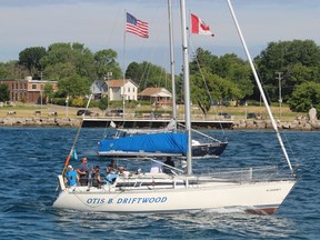 Sailboats on the St. Clair River head for Lake Huron near Point Edward Saturday for the start of the annual Port Huron to Mackinac Island sailboat race.