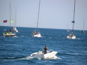 Sailboats head into Lake Huron near Sarnia Saturday for the start of the annual Port Huron to Mackinac Island sailboat race.